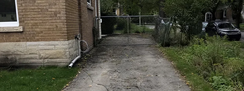 Asphalt paving crew working on a driveway in Denver Colorado
