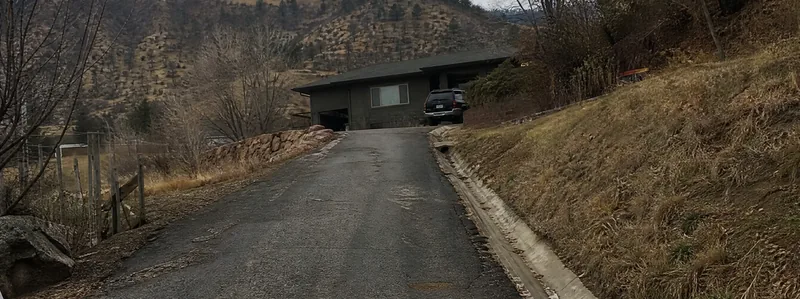 Asphalt paving crew working on a driveway in Golden Colorado