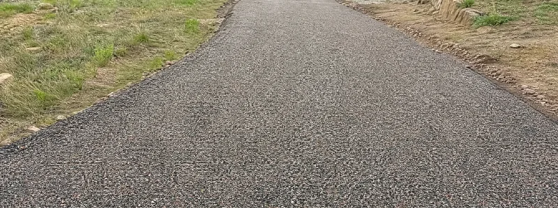 Tar and chip driveway surface texture in Arvada Colorado